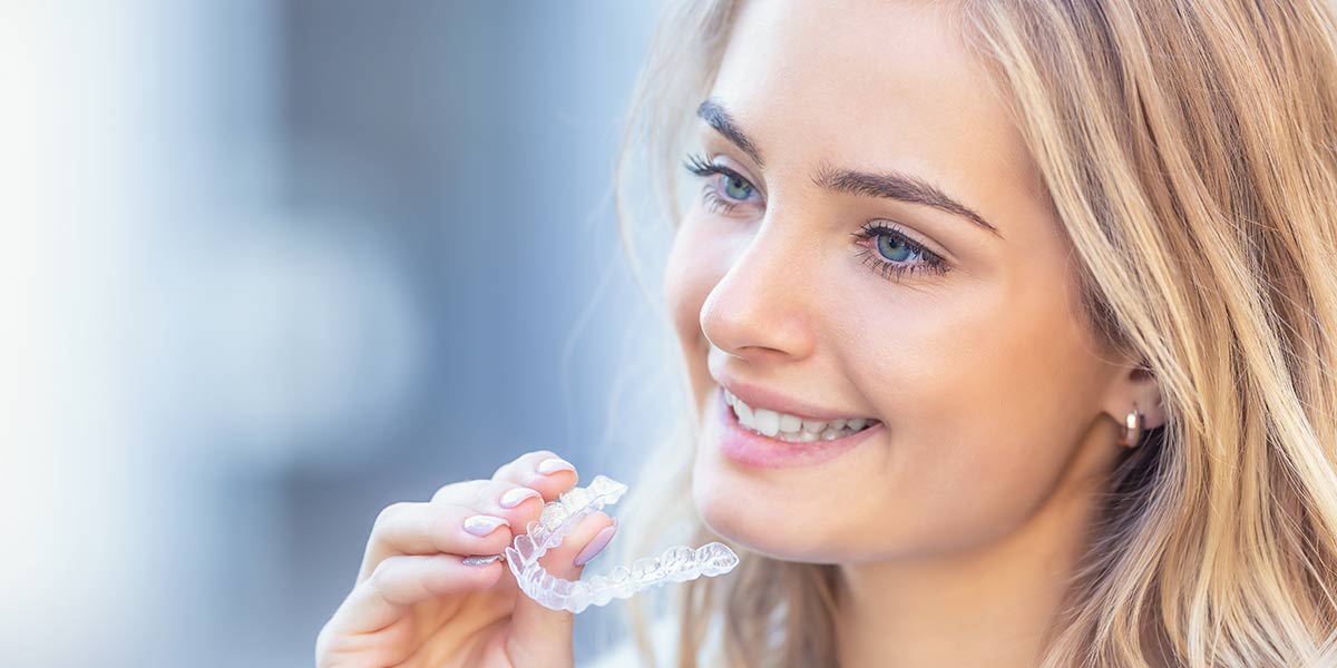 perfect smile with Invisalign teeth aligners, consult Dr. Boris Yusupov
